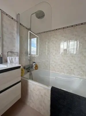 a bathroom with a tub and a sink and a shower at Golden Island in Porto Santo