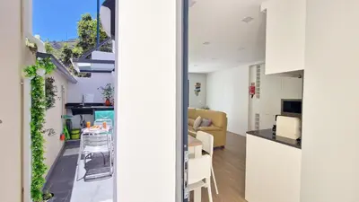 a kitchen and dining room with a view of a living room at Casa D'Além I & II by LovelyStay in Machico