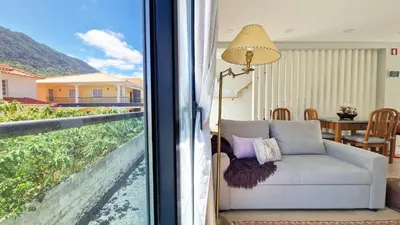 a living room with a couch and a window at Casa D'Além I & II by LovelyStay in Machico