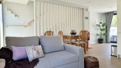 a living room with a couch with pillows on it at Casa D'Além I & II by LovelyStay in Machico