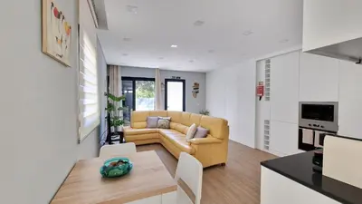 a living room with a couch and a table at Casa D'Além I & II by LovelyStay in Machico