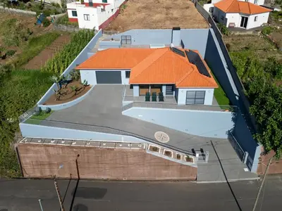 an overhead view of a house with an orange roof at Calheta Paradise Holiday Home - Free Parking & Views in Arco da Calheta