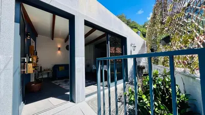 a house with glass doors and a balcony at Casa d Avó 1937, By OP in Senhora do Rosário