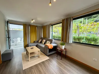 a living room with a couch and a table at Marialina, By OP in São Vicente