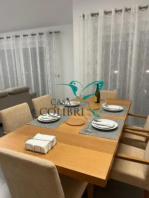 a living room with a couch and a table at Casa Colibri I in Luz