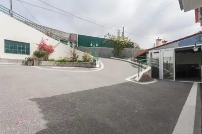 an empty parking lot in front of a building at Jango Paradise in Funchal