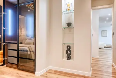 a room with a glass closet with a bed in it at Machico Fachos View, a Home in Madeira in Machico