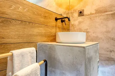 a bathroom with a sink on top of a counter at Machico Fachos View, a Home in Madeira in Machico