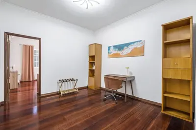 an empty room with a desk and a table at Funchal Ocean Terrace APT in Funchal