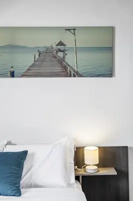 a picture of a pier over a bed at Funchal Ocean Terrace APT in Funchal