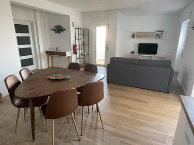 a living room with a table and chairs and a couch at Casa Dolce Farniente in Luz