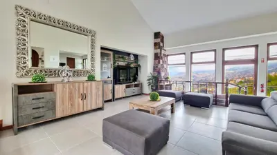 a living room with a mirror and a couch at Casa Clementine by LovelyStay in Funchal