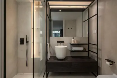 a bathroom with a sink and a tub in it at Savoy Insular VI by An Island Apart in Funchal