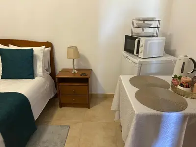 a bathroom with a toilet and a sink at Casa do Pico in Ribeira Brava