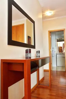 a room with a counter with a mirror on the wall at Magos Sunrise - Apt with sea view in Caniço