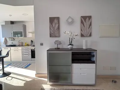 a kitchen with a counter with flowers on it at Forum Ocean View Apartment 2 in Funchal