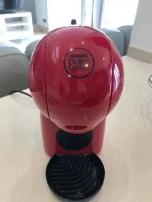 a red ketchup dog plus appliance sitting on a table at Forum Ocean View Apartment 2 in Funchal