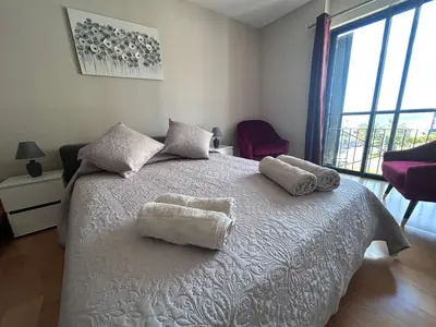 a bedroom with a white bed with two towels on it at Forum Ocean View Apartment 2 in Funchal