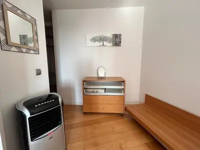 a room with a treadmill and a table with a heater at Forum Ocean View Apartment 2 in Funchal