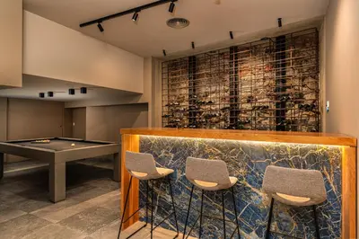 a bar with a ping pong table and chairs at Refúgio na Escarpa Luxury Villa in Quinta Grande