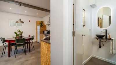 a kitchen and dining room with a table and chairs at Modern Tropical Hideaway by LovelyStay in Ponta do Sol