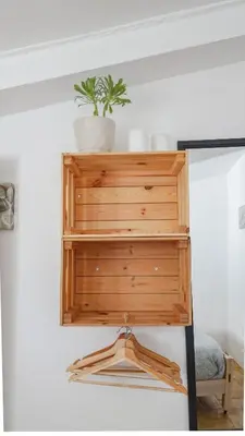 a wooden dresser with a plant on top of it at Fazenda de Quinta de Lagos in Lagos