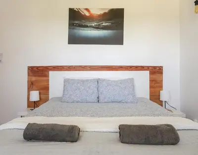 a bedroom with a large bed with two pillows on it at Fazenda de Quinta de Lagos in Lagos