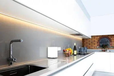 a kitchen with a sink and a counter top at Vila Indigo in Arco da Calheta