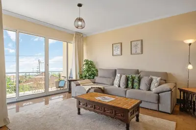 a living room with a couch and a table at Casa D Agostinha by Homie in Canhas