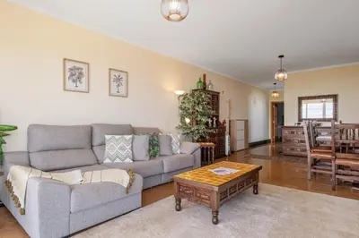 a living room with a couch and a table at Casa D Agostinha by Homie in Canhas