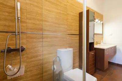 a bathroom with a toilet and a sink at GuestReady - Spacious stay with sea views in Caniço