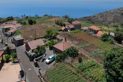 an aerial view of a small village with a house at Casa da Raposeira by An Island Apart in Calheta