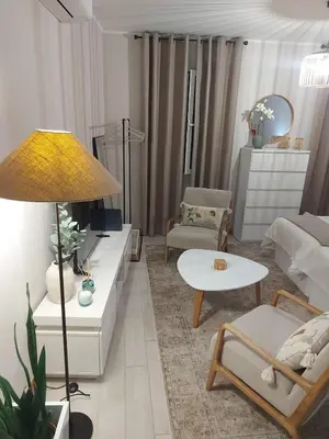 a living room with a couch and a table at Seminario Center Apartment in Funchal