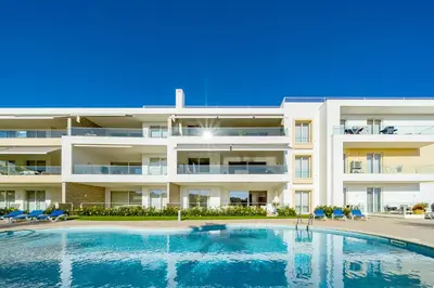a large apartment building with a swimming pool at ValMar Ocean and Pool View Apartment in Lagos