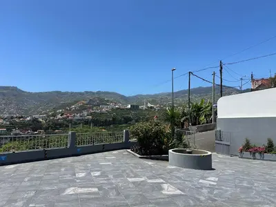 a balcony with a view of a city at Oásis Suites - Funchal in Funchal