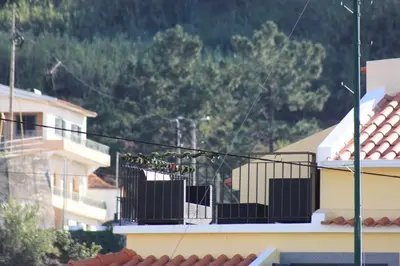 a view of a balcony of a building at Casinha Gomes in Calheta