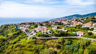 a small town on a hill at Casinha Gomes in Calheta