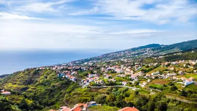 an aerial view of a small town on a mountain at Casinha Gomes in Calheta