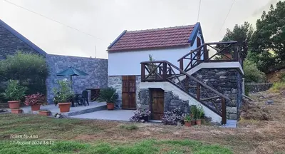 a small church with plants in front of it at Mountain View Cottage in Seixal