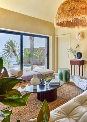 a living room with a couch and a table at Pirate House Sea front Private Pool Garden Funchal in Funchal