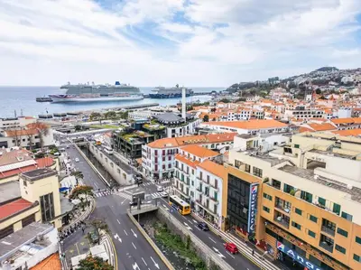 an aerial view of a city with a cruise ship at SUPER Top Floor in Funchal