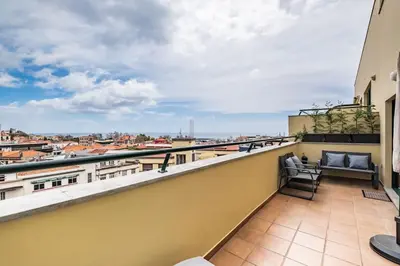 a balcony with a view of a city at SUPER Top Floor in Funchal