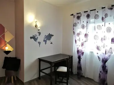 a room with a desk and a table and a window at Sea View 2-beds 'Estrela' Apartment - Praia da Luz in Luz