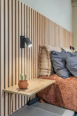 a bedroom with a bed and a table with a cactus at SUPER Seixal Beach - T0 in Seixal