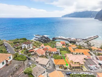 an aerial view of a town next to the ocean at SUPER Seixal Beach - T0 in Seixal