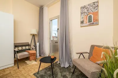 a living room with a couch and a table at SUPER Seixal Beach - T2 in Seixal