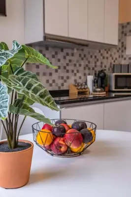 a bowl of fruit on a counter in a kitchen at SUPER Seixal Beach - T2 in Seixal
