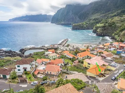 an aerial view of a village next to the ocean at SUPER Seixal Beach - T2 in Seixal