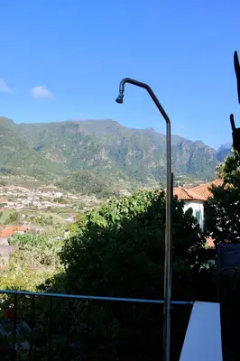 a street light with mountains in the background at Villa with Mountain view, São Vicente, Madeira in São Vicente
