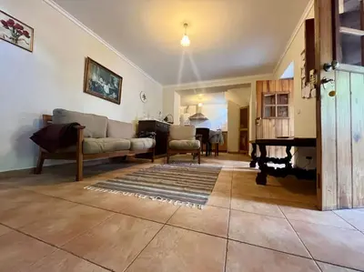 a living room with a couch and a table at Villa with Mountain view, São Vicente, Madeira in São Vicente